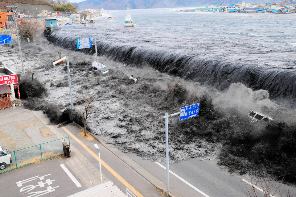 A wave approaches Miyako City from the Heigawa estuary in Iwate Prefecture after a magnitude 8.9 earthquake struck the area in Miyako, Japan, March 11, 2011.