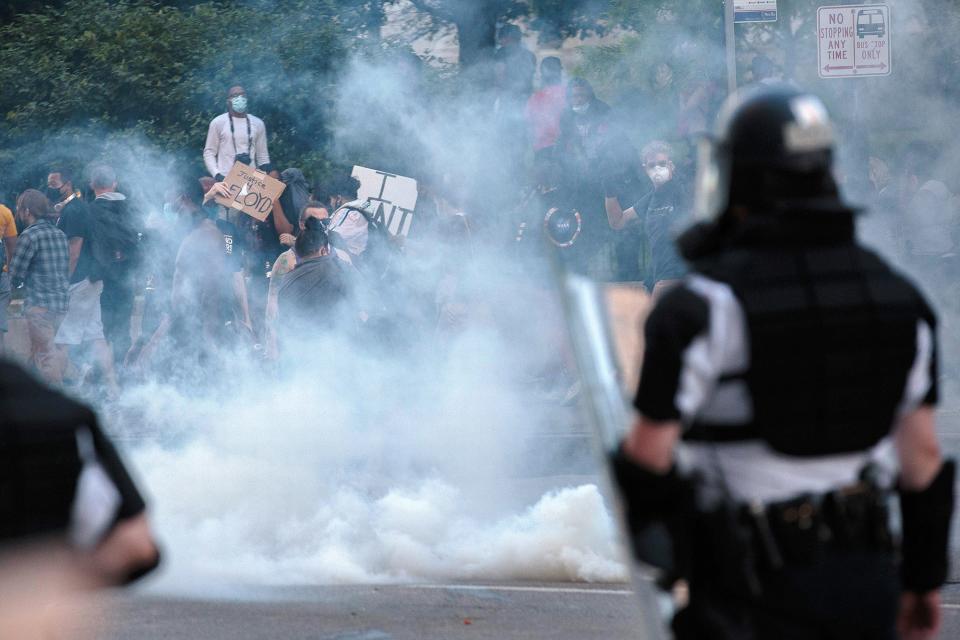 Protesters disperse after Columbus police officers deployed tear gas Downtown on May 30, 2020.