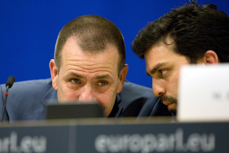 Italy's Lega party member and MEP Marco Zanni, right, speaks with Austria's FPO member and MEP Harald Vilimsky during a media conference to announce the formation of a new far-right European Parliament group at the European Parliament in Brussels, Thursday, June 13, 2019. (AP Photo/Virginia Mayo)