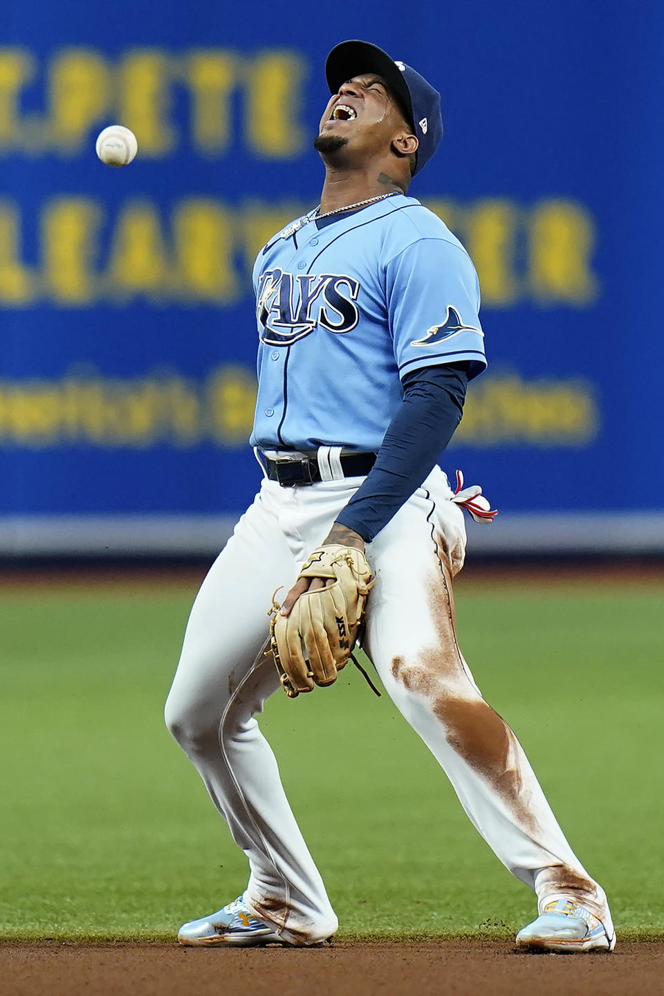 Tampa Bay Rays shortstop Wander Franco reacts after he can't make a clean play on a single by Boston Red Sox's Xander Bogaerts during the fourth inning of a baseball game Friday, July 30, 2021, in St. Petersburg, Fla. (AP Photo/Chris O'Meara)