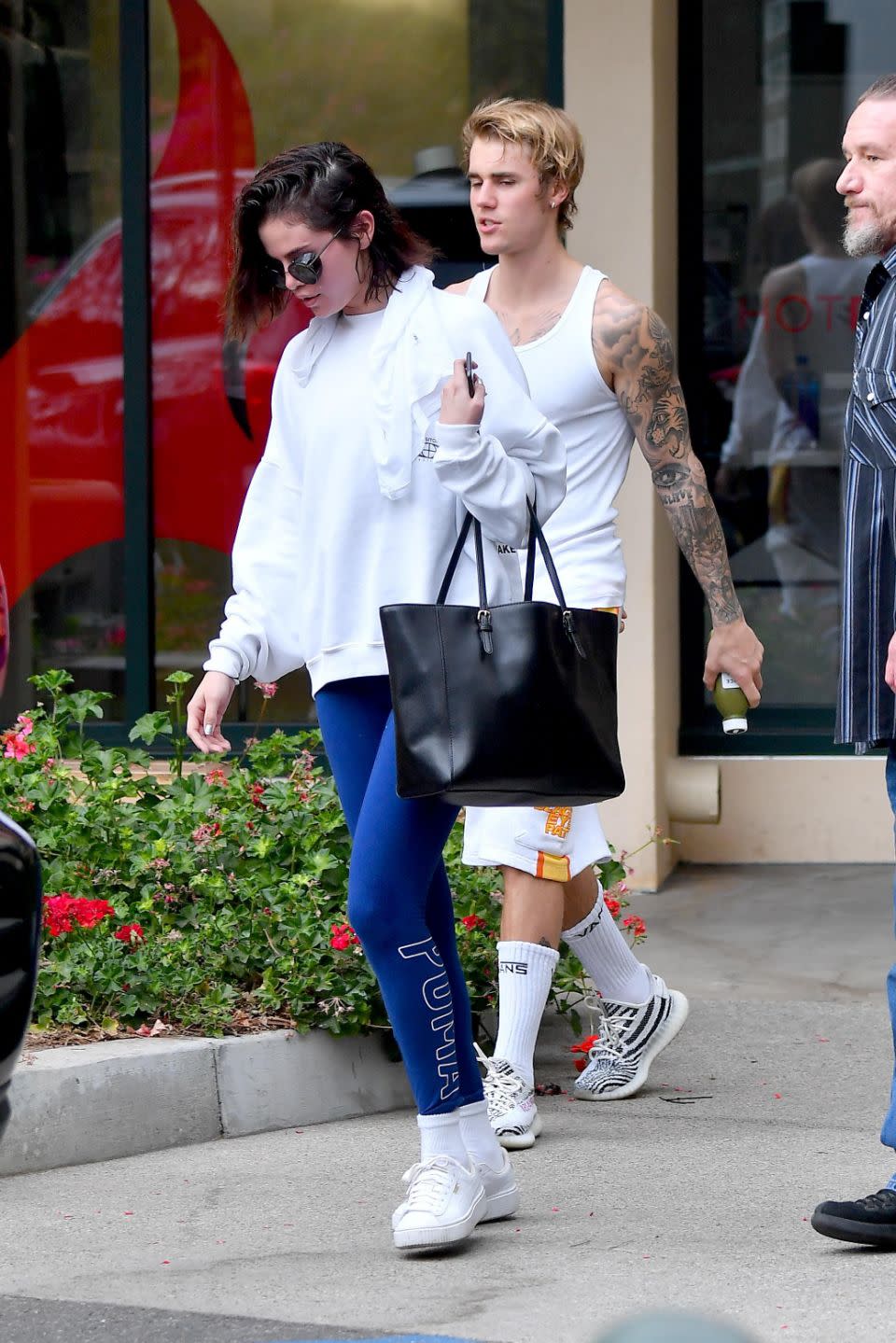 The Hollywood super couple were seen leaving a West Hollywood pilates studio where the temperatures hit 100 degrees. Source: Backgrid