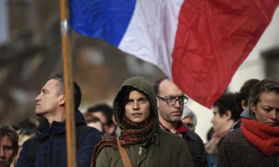 People pay a minute’s silence in tribute to the victims of the 2015 attacks at the Bataclan.