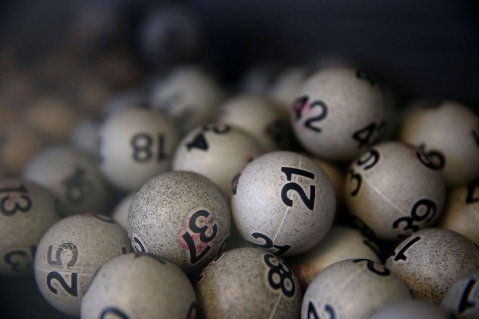 Lottery balls are seen in a box at Kavanagh Liquors in 2015 in San Lorenzo, California. No one hit the Powerball jackpot Monday, so the prize now soars to an estimated $1.2 billion.