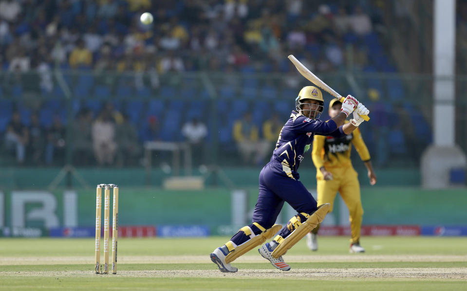 Quetta Gladiators batsman Sarfraz Ahmed follows the ball after playing a shot during the Pakistan Super League T20 cricket match between Quetta Gladiators and Peshawar Zalmi at National stadium in Karachi, Pakistan, Saturday, Feb. 22, 2020. (AP Photo/Fareed Khan)