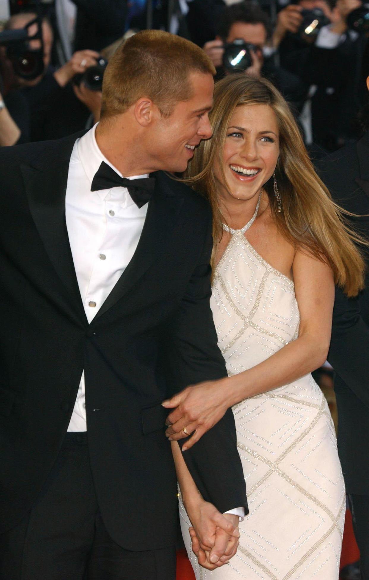 Star of the film Brad Pitt and his wife Jennifer Aniston arrive for the premiere of Troy, at the Palais de Festival during the 57th Cannes Film Festival in France.   (Photo by Ian West - PA Images/PA Images via Getty Images)