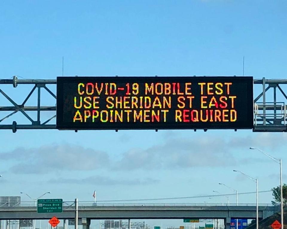 Highway traffic sign on I-75 gives drivers directions to the COVID-19 testing site at C.B. Smith Park in southwest Broward.