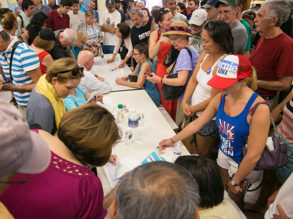 Voters crowd the voting tables during the Hawaii caucus at Kailua Intermediary School, in Kailua, Hawaii.