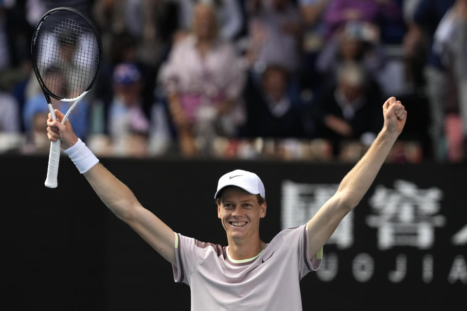 Jannik Sinner of Italy celebrates after defeating Novak Djokovic of Serbia in their semifinal at the Australian Open tennis championships at Melbourne Park, Melbourne, Australia, Friday, Jan. 26, 2024. (AP Photo/Alessandra Tarantino)