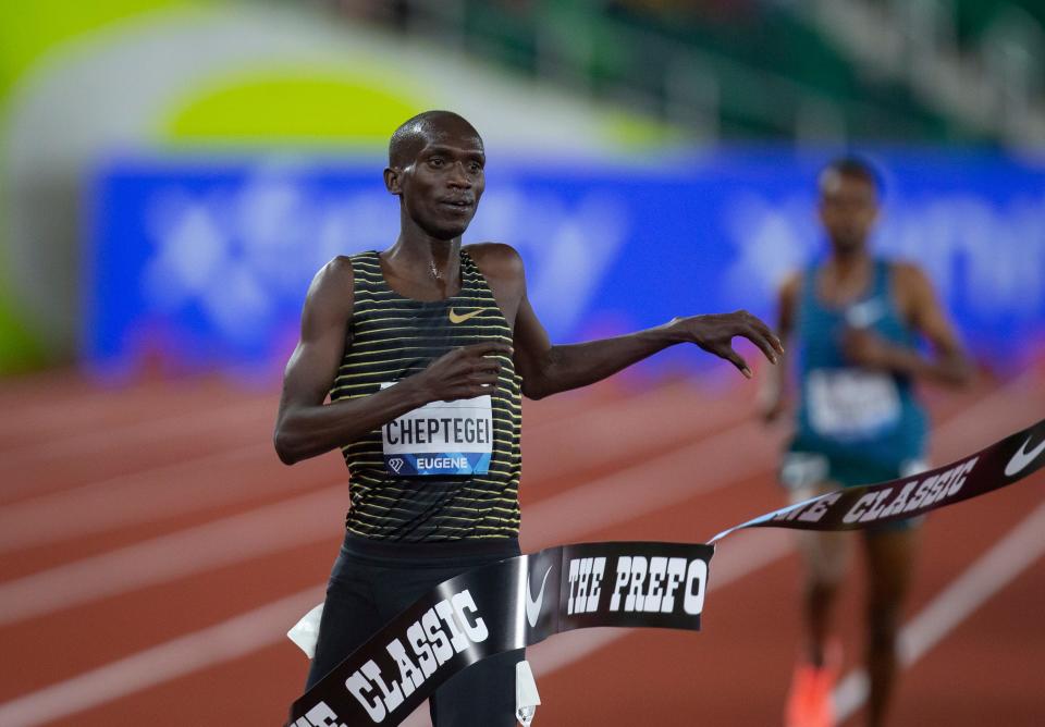 Joshua Cheptegei crosses the finish line to win the men's 5,000 meters at the 2022 Prefontaine Classic at Hayward Field Friday, May 27, 2022.