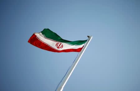 FILE PHOTO: An Iranian national flag flutters during the opening ceremony of the 16th International Oil, Gas & Petrochemical Exhibition (IOGPE) in Tehran April 15, 2011. REUTERS/STR/File Photo