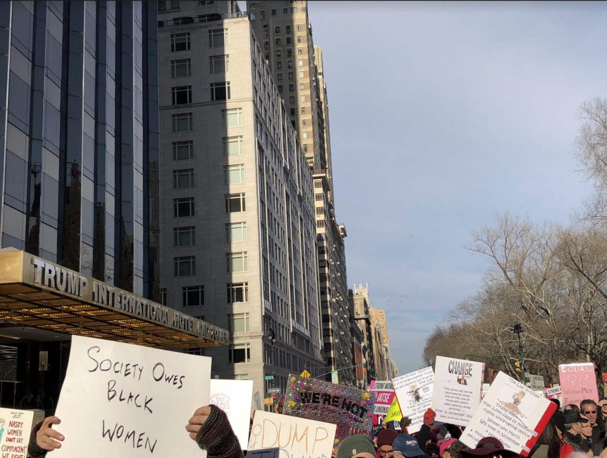 Marchers passing the Trump International Hotel. (Photo: Jackson Freiman)