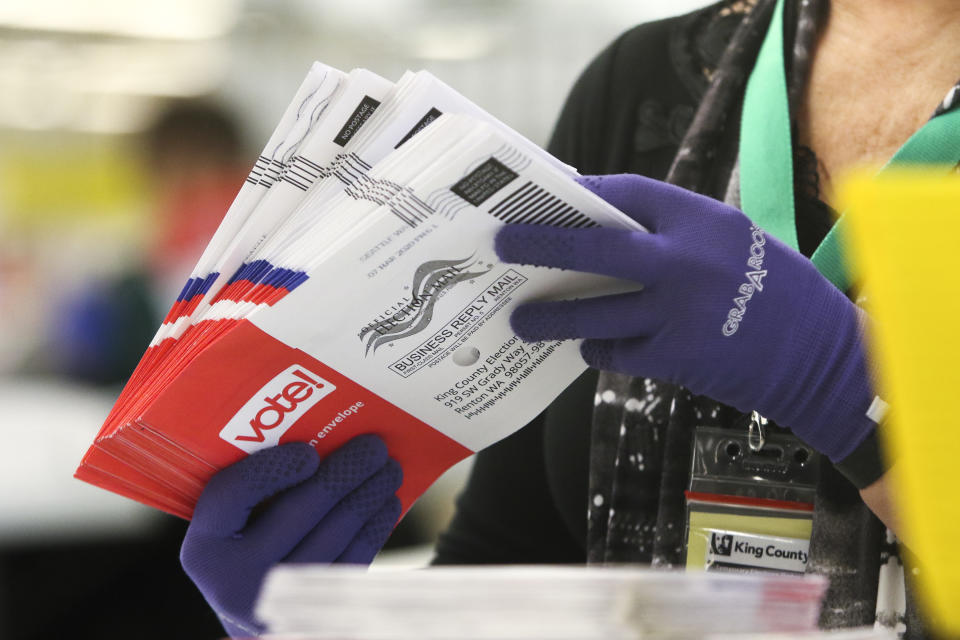 An election workers sorts vote-by-mail ballots for the presidential primary at King County Elections in Renton, Washington on March 10, 2020. (Jason Redmond/AFP via Getty Images)