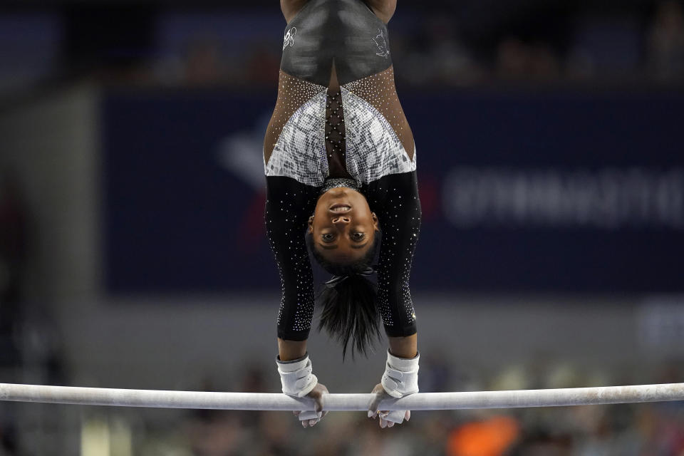 Simone Biles competes on the uneven bars during the U.S. Gymnastics Championships, Sunday, June 6, 2021, in Fort Worth, Texas. (AP Photo/Tony Gutierrez)