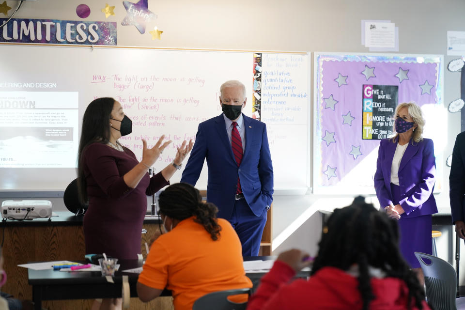 Brookland Middle School science teacher Michelle Taylor speaks to President Joe Biden and first lady Jill Biden as they tour Brookland Middle School, Friday, Sept. 10, 2021 in Washington. Biden has encouraged every school district to promote vaccines, including with on-site clinics, to protect students as they return to school amid a resurgence of the coronavirus. (AP Photo/Manuel Balce Ceneta)