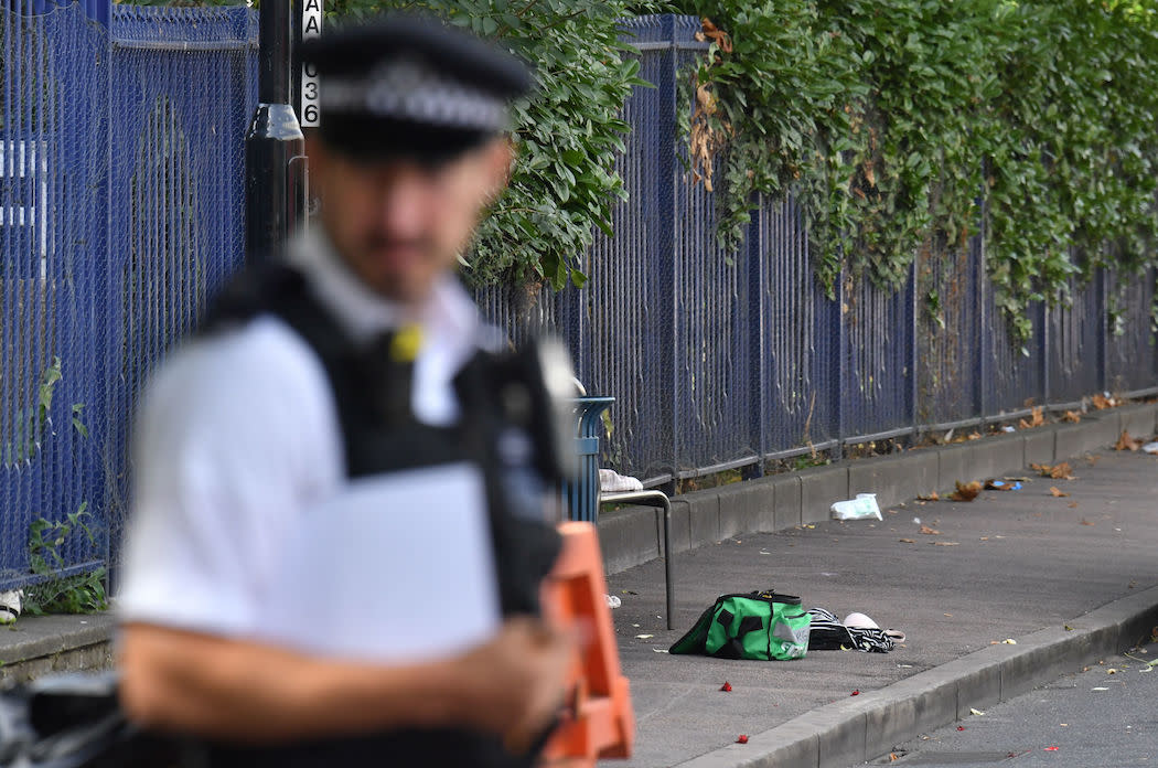 A police officer guards the scene of a stabbing in Woolwich in London (Picture: PA)