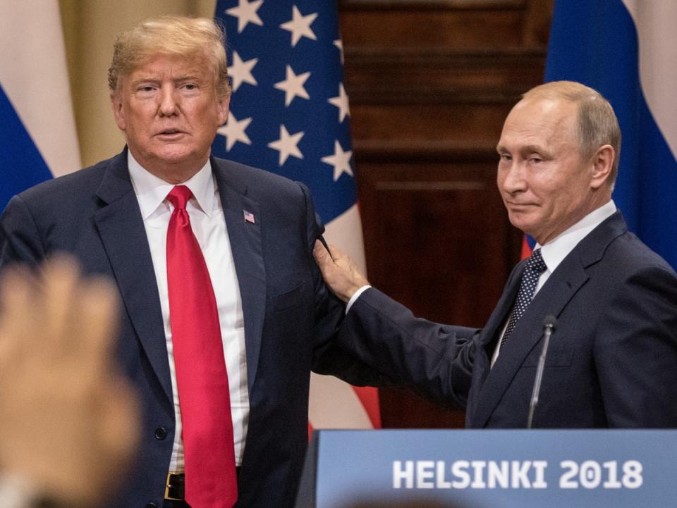 Donald Trump and Russian president Vladimir Putin shake hands at their summit  in Helsinki, Finland, on July 16 2018 (Chris McGrath/Getty)