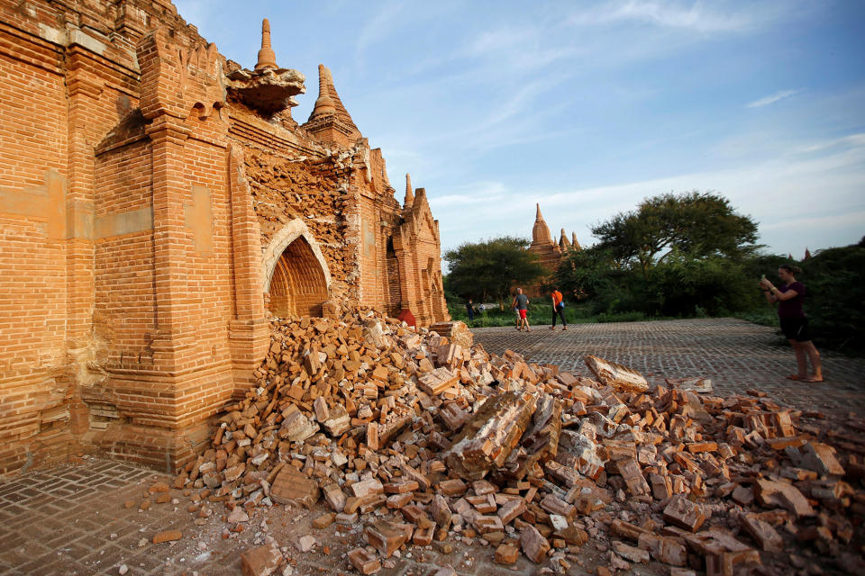 <p>People walk past a damaged pagoda after an earthquake in Bagan, Myanmar August 25, 2016. (REUTERS/Soe Zeya Tun) </p>