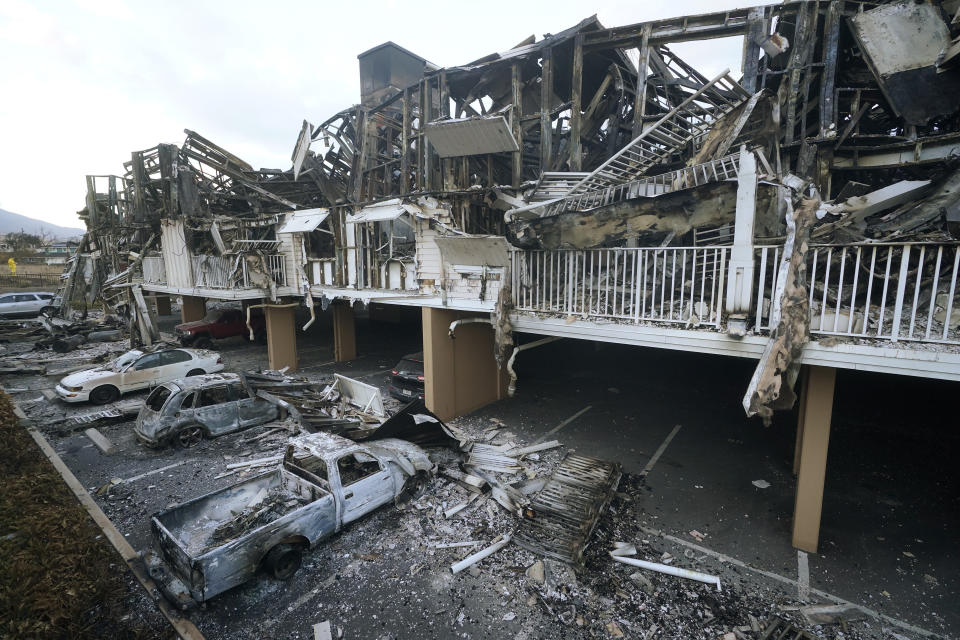 FILE - Wildfire wreckage is shown on Aug. 11, 2023, in Lahaina, Hawaii. Hawaii Gov. Josh Green is announcing the creation of a $150 million fund to help those who lost family members or who were injured in Maui’s wildfires. The governor's office says beneficiaries will receive payments of more than $1 million as early as the April-June quarter of next year. (AP Photo/Rick Bowmer, File)