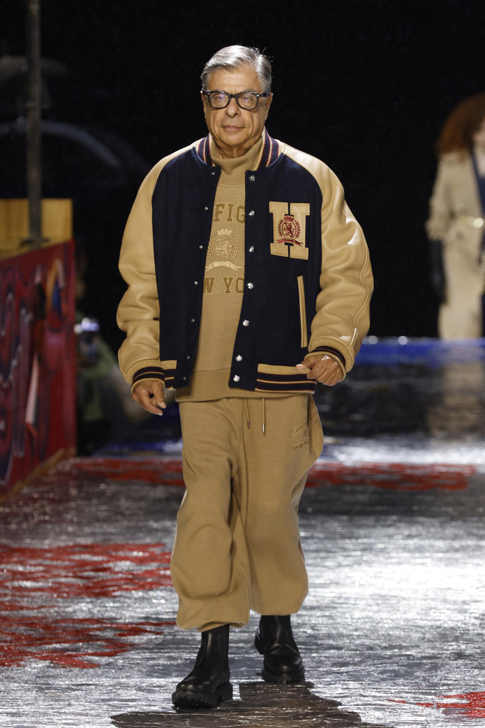 Bob Colacello walks in the Tommy Hilfiger Fall 2022 collection show during Fashion Week, Sunday, Sept. 11, 2022, in New York. (AP Photo/Jason DeCrow)