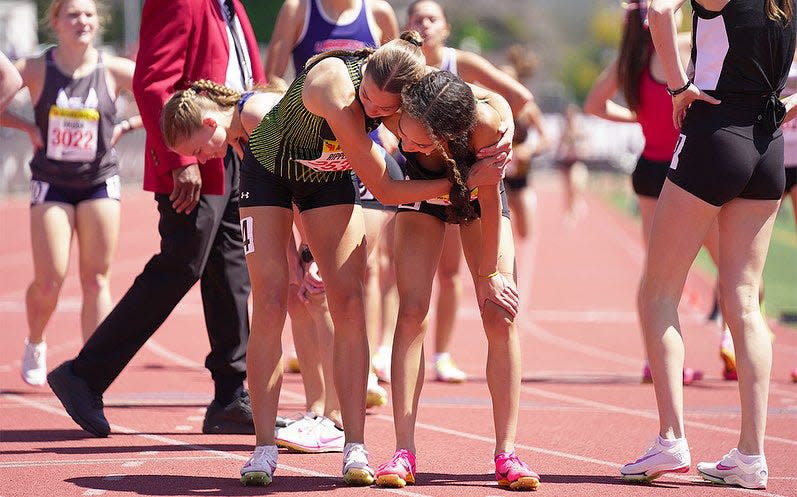 Queen Creek sophomore Nicole Ripperdan (left) and Basha junior Kayla Lark (right) embrace after running in the 800 meters at the Arcadia Invitational in Arcadia, Calif. on April, 6, 2024.