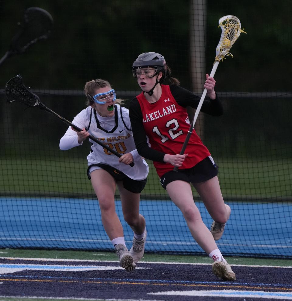 Wayne, NJ - May 3, 2023 —  Ashley Czeczuga of West Milford and Lauren Vignola of Lakeland as Lakeland topped West Milford 12-7 in the Passaic County Girls Lacrosse Tournament 14-5.