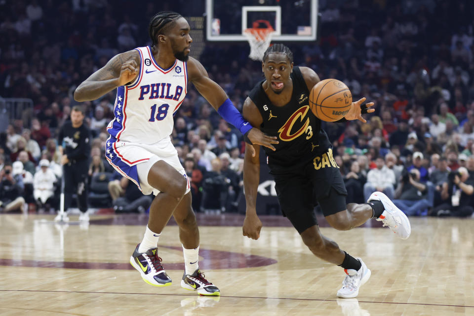 Cleveland Cavaliers guard Caris LeVert (3) drives against Philadelphia 76ers guard Shake Milton (18) during the first half of an NBA basketball game, Wednesday, March 15, 2023, in Cleveland. (AP Photo/Ron Schwane)