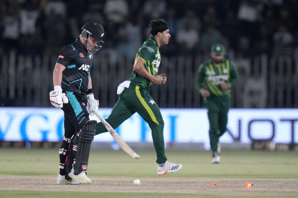 New Zealand's Tim Seifert, left, reacts after he bowled out by Pakistan's Abbas Afridi, center, during the third T20 international cricket match between Pakistan and New Zealand, in Rawalpindi, Pakistan, Sunday, April 21, 2024. (AP Photo/Anjum Naveed)