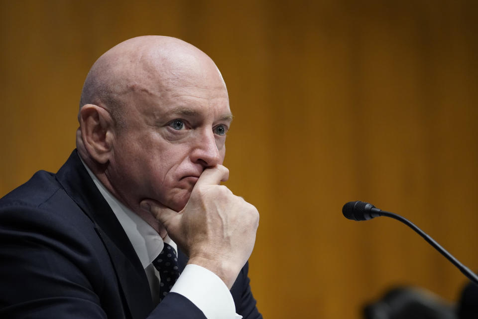 Sen. Mark Kelly, D-Ariz., listens during a Senate Energy and Natural Resources Committee hearing on Capitol Hill in Washington, Thursday, March 11, 2021, to examine the reliability, resiliency, and affordability of electric service in the United States amid the changing energy mix and extreme weather events. (AP Photo/Susan Walsh)