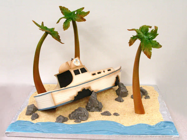 <div class="caption-credit"> Photo by: Cake by Mike's Amazing Cakes.</div>For the jetsetting couple or as a teaser for your honeymoon, a travel-themed cake is a fun choice. Show off your favorite travel destination or activity, from lounging on the beach to a favorite theme park.