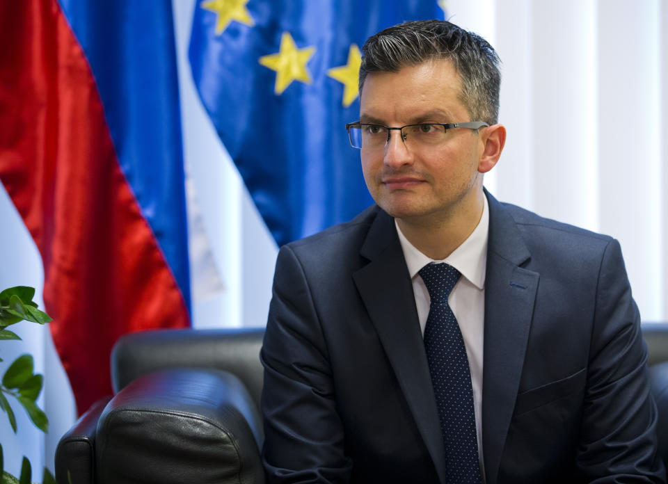 Slovenia's prime minister Marjan Sarec listens to reporter's question during an interview with the Associated Press in Ljubljana, Slovenia, Tuesday, April 23, 2019. (AP Photo/Darko Bandic)