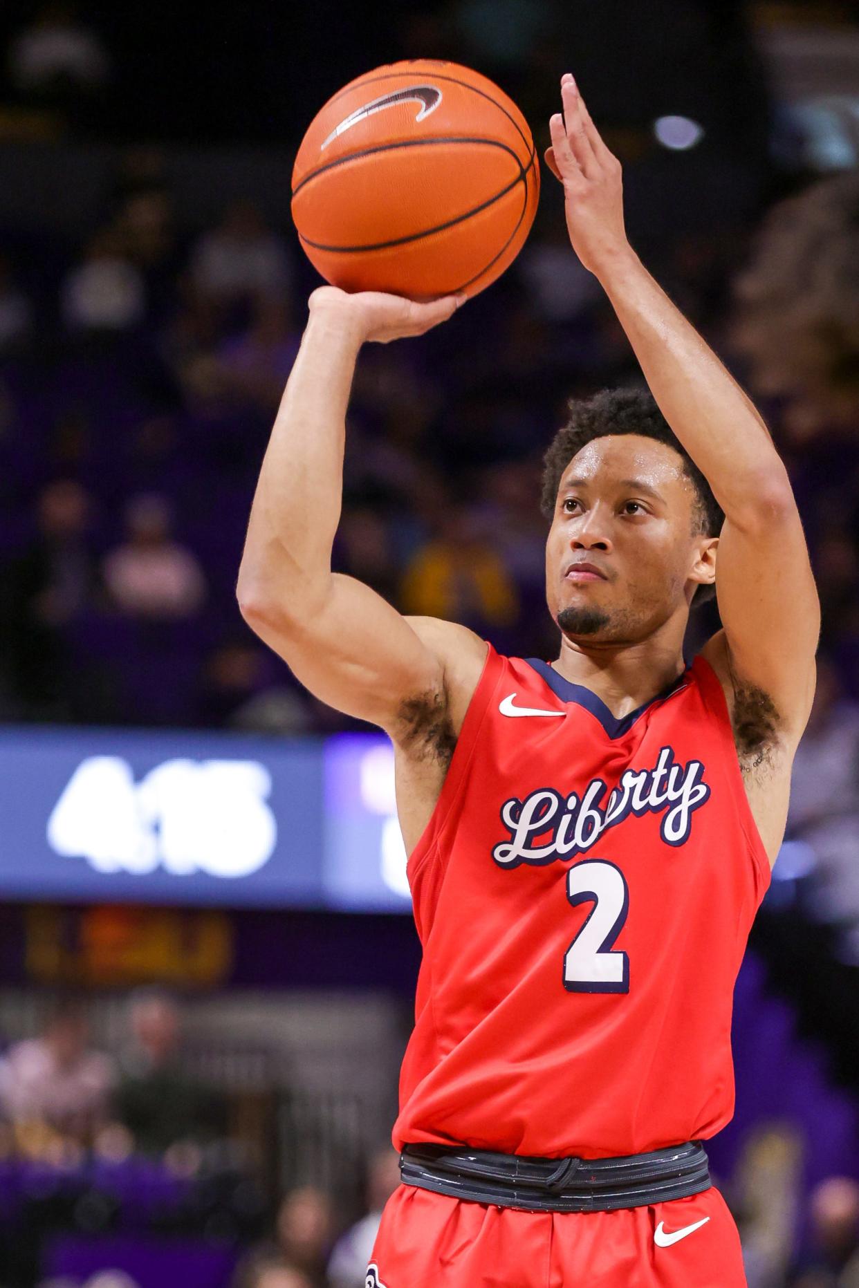 Liberty Flames guard Darius McGhee (2) shoots a free throw. McGhee tops the ASUN scoring charts for Liberty, which is bidding for another conference championship.