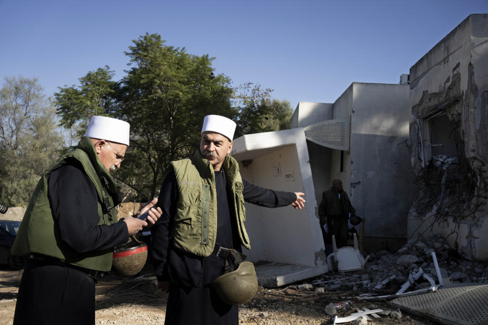 Druze faith leaders tour Kibbutz Kfar Azza with their Muslim, Jewish and Christian counterparts ahead of an interfaith joint prayer near the Israel-Gaza border, the site of an Oct. 7 cross-border attack by Hamas who killed some 1,200 people, Wednesday, Nov. 29, 2023. (AP Photo/Maya Alleruzzo)