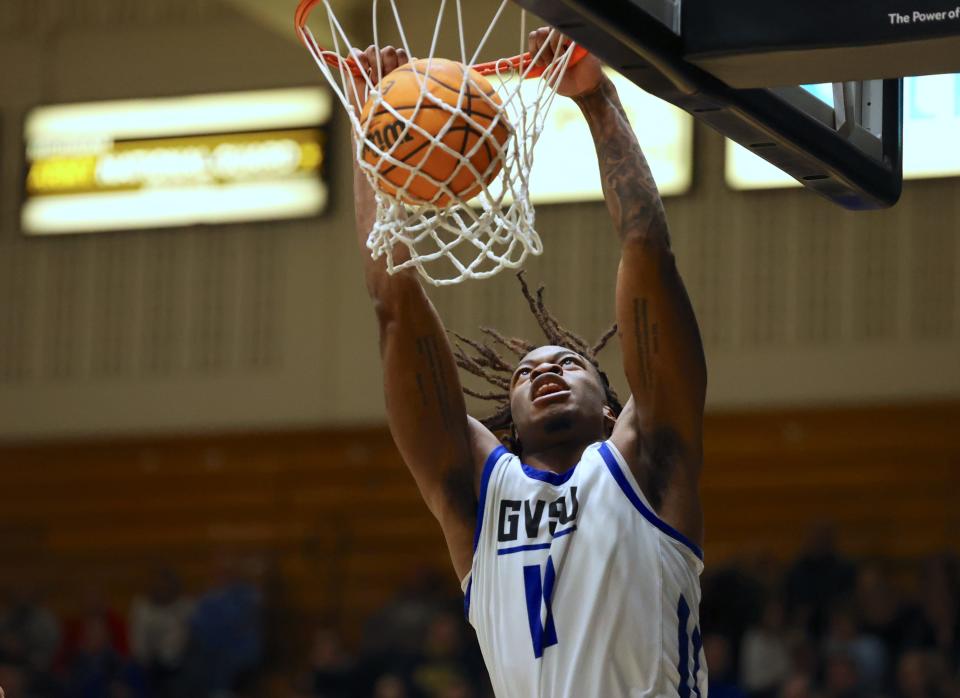 Kingsley Okanu dunks the ball in the second half against Ferris State on Saturday in Allendale.