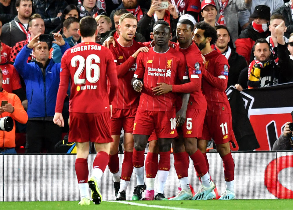 Liverpool's Sadio Mane celebrates his sides first goal of the game with teammates
