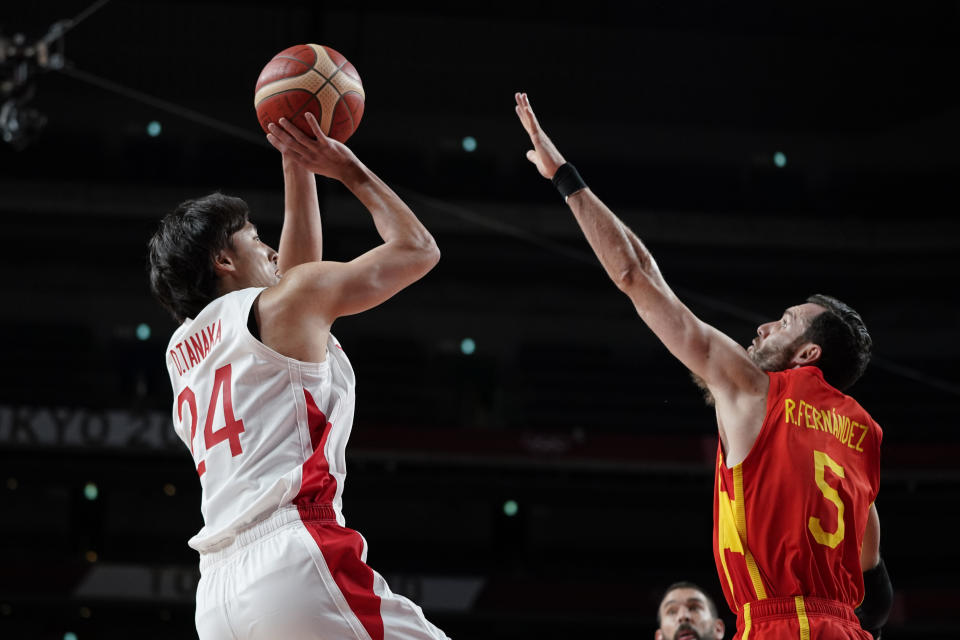 Japan's Daiki Tanaka (24) shoots on Spain's Rudy Fernandez (5) during a men's basketball preliminary round game at the 2020 Summer Olympics in Saitama, Japan, Monday, July 26, 2021. (AP Photo/Charlie Neibergall)