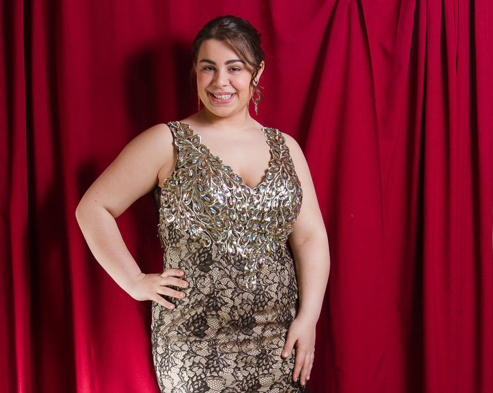 This undated image released by New York City Glitz shows Maria Giorno, 18, a high school senior from Manchester Township, N.J., models a prom dress at New York City Glitz boutique in Pine Beach, N.J. (AP Photo/New York City Glitz, Philip Shepherd)