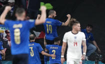 Italy's Leonardo Bonucci celebrates after he scored his side's first goal during the Euro 2020 soccer championship final between England and Italy at Wembley stadium in London, Sunday, July 11, 2021. (AP Photo/Frank Augstein, Pool)