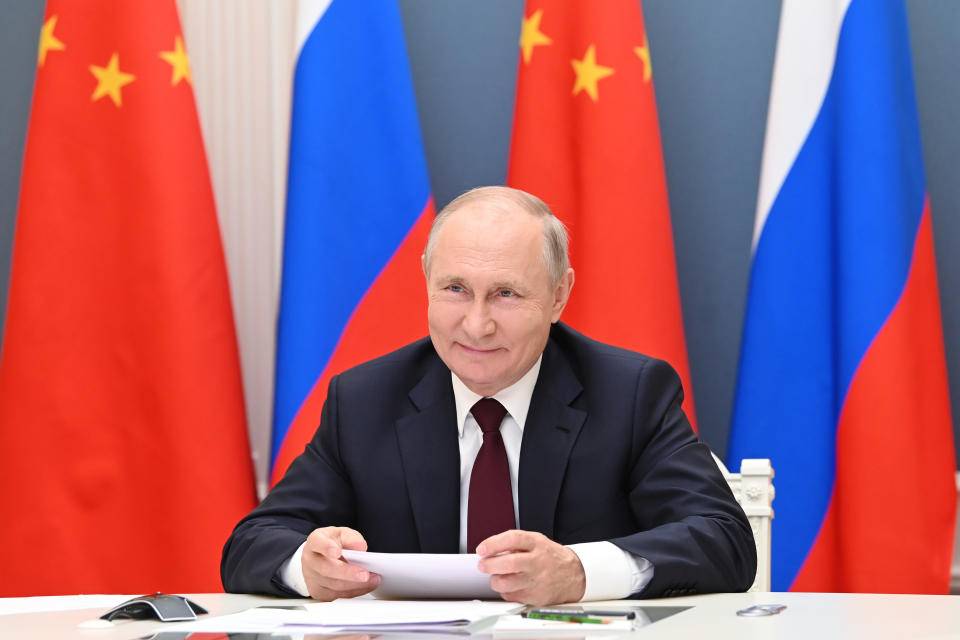 Russian President Vladimir Putin talks with Chinese President Xi Jinping, on the screen, via video conference in Moscow, Russia, Monday, June 28, 2021. (Alexei Nikolsky, Sputnik, Kremlin Pool Photo via AP)