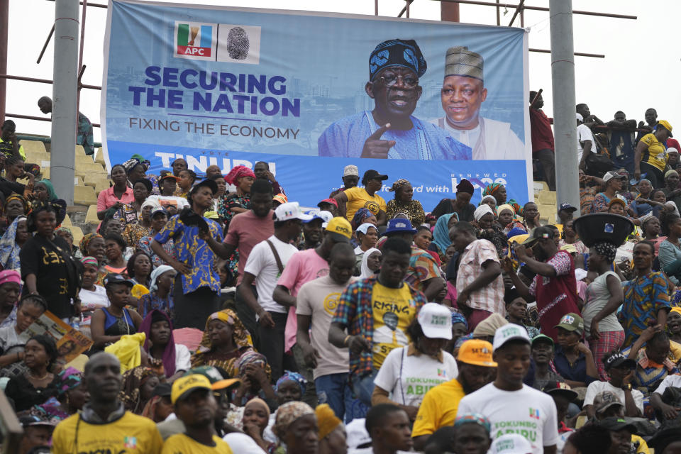 Supporters of Bola Ahmed Tinubu, presidential candidate of the All Progressives Congress, Nigeria ruling party during an election campaign rally at the Teslim Balogun Stadium in Lagos Nigeria, Tuesday, Feb. 21, 2023. Fueled by high unemployment and growing insecurity, younger Nigerians are mobilizing in record numbers to take part in this month's presidential election. (AP Photo/Sunday Alamba)