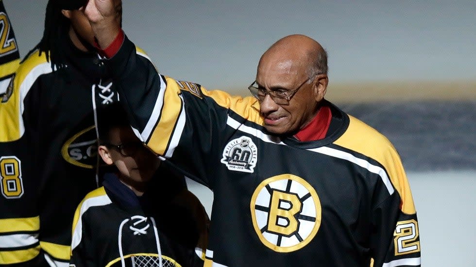 Former Boston Bruins' Willie O'Ree tips his hat as he is honored