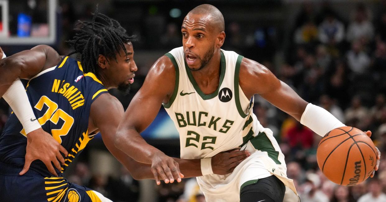 Milwaukee Bucks forward Khris Middleton (22) drives to the basket as Indiana Pacers forward Aaron Nesmith (23) defends during the game between Indiana Pacers and Milwaukee Bucks Wednesday, Jan. 3, 2024, at Gainbridge Fieldhouse in Indianapolis. The halftime score was 68-66 Bucks.