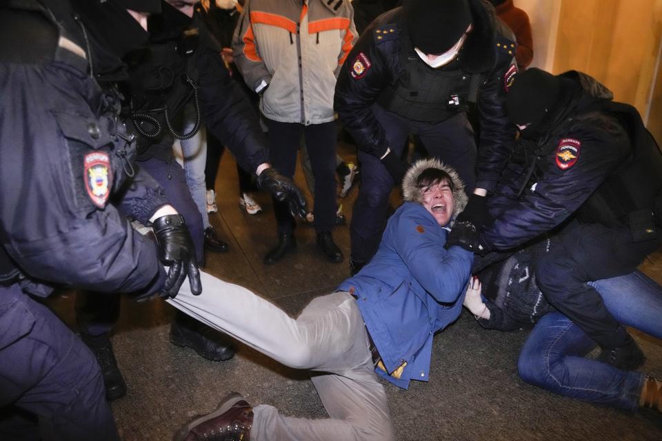 FILE - Police officers detain demonstrators in St. Petersburg, Russia, Feb. 24, 2022. When President Vladimir Putin sent troops to Ukraine, a massive wave of outrage and anti-war sentiment swept Russia. The Kremlin in response insisted that what it called a “special military operation” in Ukraine attracted overwhelming public support, and moved swiftly to suppress any dissent. (AP Photo, File)