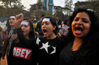 Women shout slogans as they take part in the #IWillGoOut rally, to show solidarity with the Women's March in Washington, along a street in Bengaluru, January 21, 2017. REUTERS/Abhishek N. Chinnappa