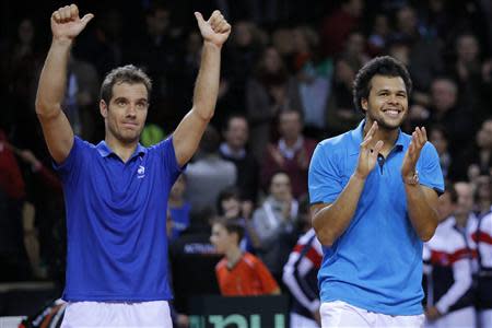 French players Jo-Wilfried Tsonga (R) and Richard Gasquet celebrate after defeating Australian players Lleyton Hewitt and Chris Guccione during their Davis Cup world group first round tennis doubles match in Mouilleron-Le-Captif, Western France, February 1, 2014. REUTERS/Stephane Mahe