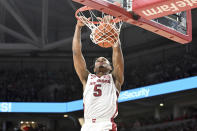 Arkansas guard Au'Diese Toney (5) dunks against Texas A&M during the first half of an NCAA college basketball game Saturday, Jan. 22, 2022, in Fayetteville, Ark. (AP Photo/Michael Woods)