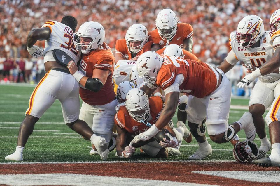 Texas Longhorns running back Jaydon Blue (23) scores a touchdown as he dives into the end zone as the Texas Longhorns take on ULM at Darrell K Royal-Texas Memorial Stadium in Austin Saturday, Sept. 21, 2024.