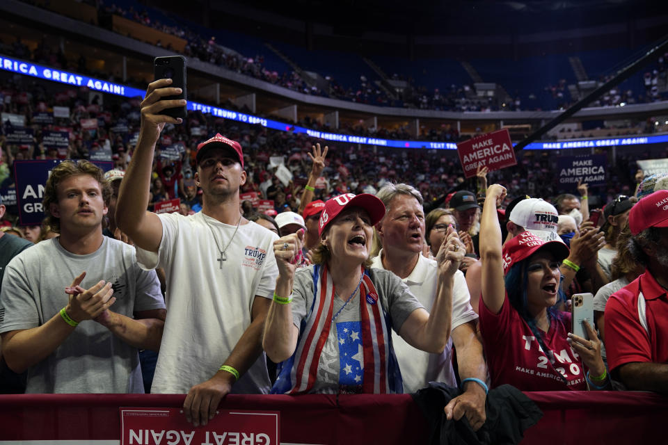 President Donald Trump supporters cheer as they attend a campaign rally at the BOK Center, Saturday, June 20, 2020, in Tulsa, Okla. (AP Photo/Evan Vucci)