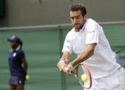 Marin Cilic of Croatia hits the ball during his match against Hiroki Moriya of Japan at the Wimbledon Tennis Championships in London, June 29, 2015. REUTERS/Henry Browne