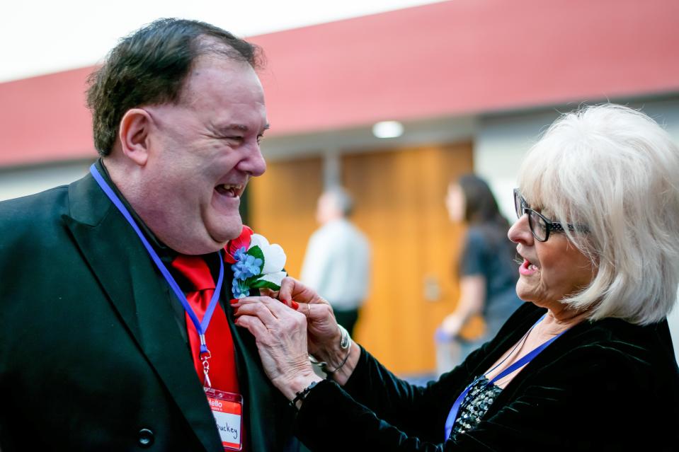 Frank Buckey gets his boutonniere before the 2020 Night to Shine event.