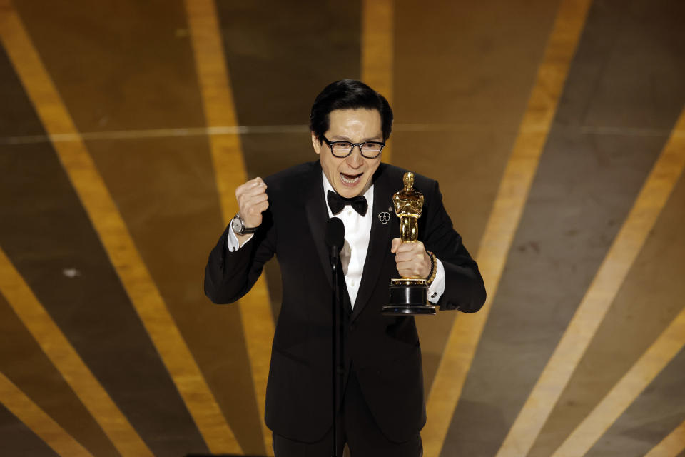 Ke Huy Quan accepts the Best Supporting Actor award for Everything Everywhere All at Once onstage at the Academy Awards on March 12.